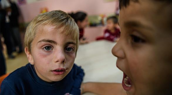 أطفال سوريون في مدرسة بمخيم كيليس للاجئين جنوب شرق تركيا (أ ف ب)