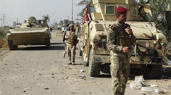 قوات عراقية قبيل انسحابها من الرمادي(أرشيف)