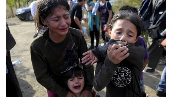 أطفال من المهاجرين السوريين بعد وصولهم إلى بر جزيرة كوس اليونانية(أرشيف)