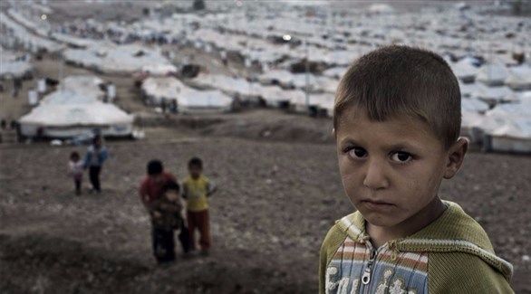 طفل سوري لاجئ خارج مخيم، إلى الغرب من أربيل، العراق(اليونيسف)