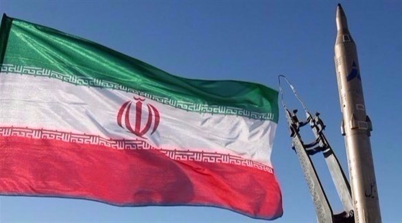 العلم الإيراني ومجسم لصاروخ.(أرشيف)