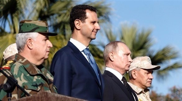 بوتين خلال لقائه الأسد في قاعدة حميميم (أرشيف)