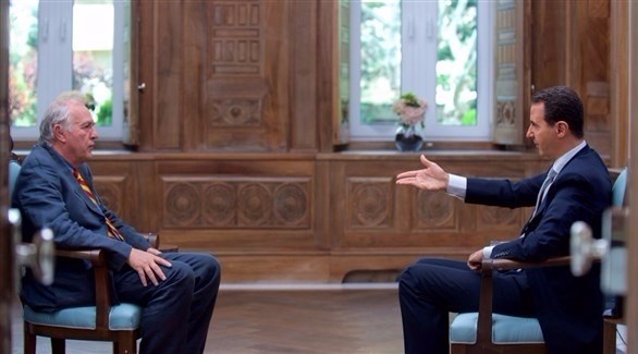 الأسد خلال المقابلة مع الوكالة الفرنسية (أ ف ب)