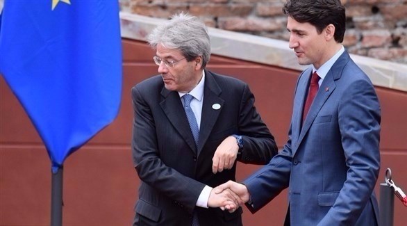 رئيس الوزراء الكندي جاستين ترودو مع نظيره الإيطالي باولو جينتيلوني (إ ب أ)