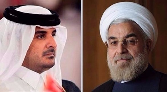 الرئيس الإيراني حسن روحاني وأمير قطر تميم بن حمد آل ثاني (أرشيف)