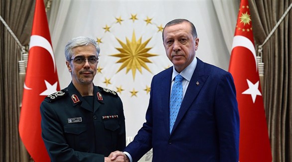 الرئيس التركي رجب طيب أردوغان والجنرال الغيراني محمد حسين باقري.(أرشيف)