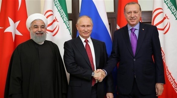 الرئيس التركي رجب طيب أردغان ونظيره الروسي والإيراني (أرشيف)