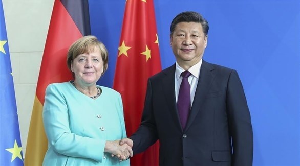 المستشارة الألمانية أنجيلا ميركل والرئيس الصيني شي جين بينغ (أرشيف)