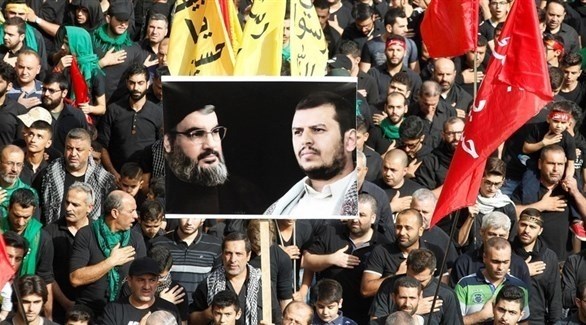 أنصار حزب الله يرفعون صورة حسن نصرالله وعبدالملك الحوثي في بيروت عام 2016 (أرشيف)
