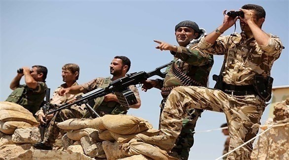 مقاتلون أكراد على دبهة الرقة قبل تحريرها من داعش.(أرشيف)