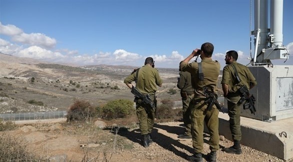 جنود إسرائيليون عند السياج الشائك في الجولان (أرشيف)