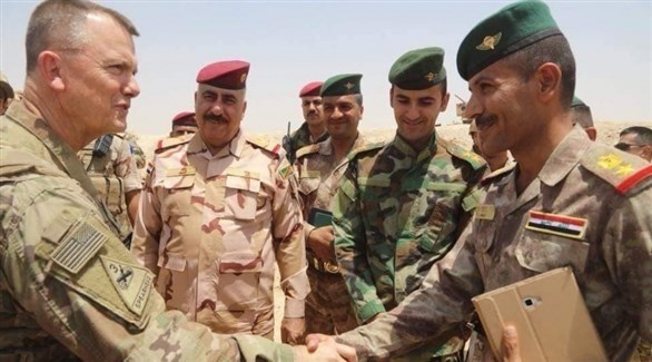 قيادات عسكرية عراقية في لقاء سابق مع قيادات في التحالف الدولي غرب الأنبار (أرشيف)