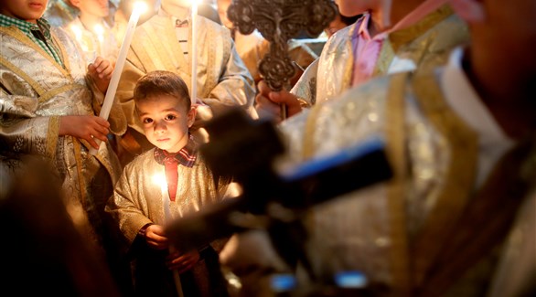مسيحيون فلسطينيون يحضرون يوم عيد الفصح في كنيسة القديسة بورفيريوس بغزة