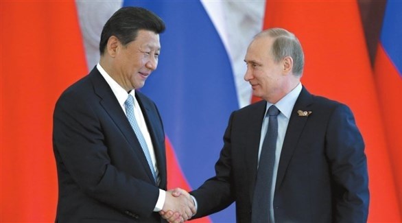 بوتين وشي خلال لقاءهما في بكين (أرشيف)