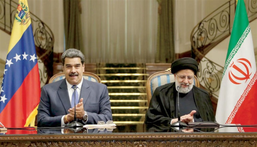 الرئيسان الإيراني ابراهيم رئيسي والفنزويلي نيكولاس مادورو (أرشيف)