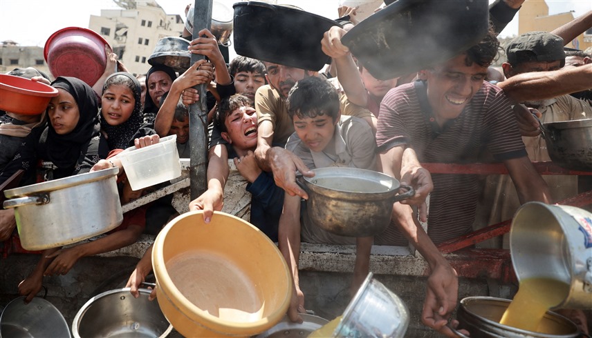 صراع الجوعى في غزة (رويترز)