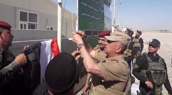 القوات العراقية ترفع العلم العراقي في قضاء خانقين (أرشيف)