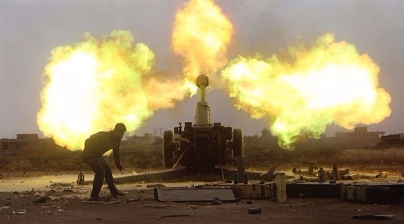 وحدة من الميليشيات الشيعية تقصف مواقع لداعش في البعاج.(رويترز)