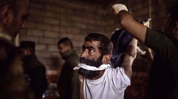 صورة عن شريط فيديو يظهر تعذيب معتقلين في الموصل.(أرشيف)