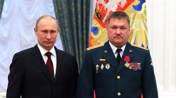  الجنرال فاليري أسابوف بجانب الرئيس الروسي فلاديمير بوتين
