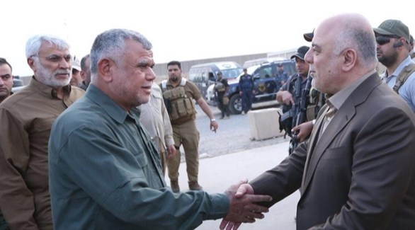 رئيس الوزراء العراقي حيدر العبادي-  وزعيم  "بدر "الموالية لإيران هادي العامري(أرشيف)