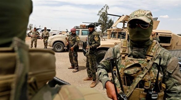 مقاتلون من قوات سوريا الديمقراطية يستعدون لشن هجوم على داعش.(أرشيف)