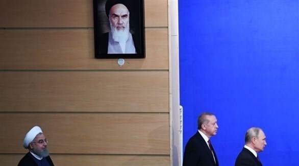 الرؤساء الروسي فلاديمير بوتين والتركي رجب طيب أردوغان والإيراني حسن روحاني قبل مؤتمر صحافي في طهران عام 2018.(أرشيف)