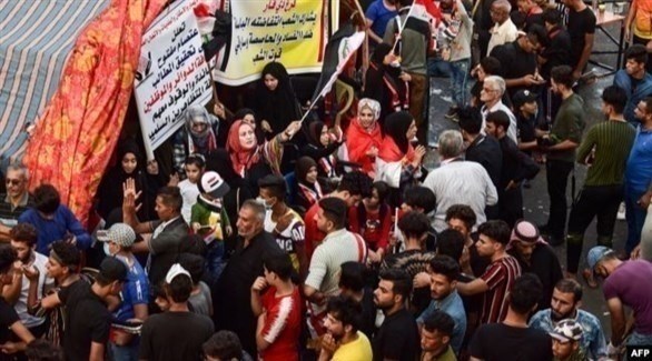 متظاهرون عراقيون في مدينة الناصرية (أ ف ب )