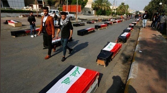 نعوش رمزية أثناء تأبين ضحايا الاحتجاجات في العراق (تويتر)