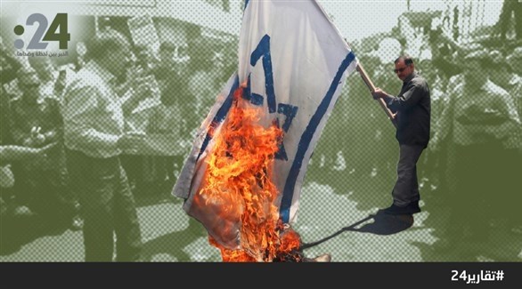 إيرانيون يحرقون علماً إسرائيلياً في يوم القدس في طهران