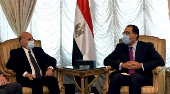 لقاء سابق بين رئيس الوزراء المصري مصطفى مدبولي ووزير الخارجية العراقي (ارشيف)