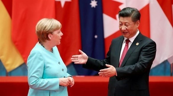 المستشارة الألمانية انغيلا ميركل والرئيس الصيني تشي غين بينغ (أرشيف)