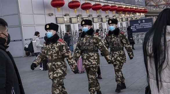 دورية أمن صينية لمراقبة الالتزام بوضع الأقنعة الواقية (أرشيف) 