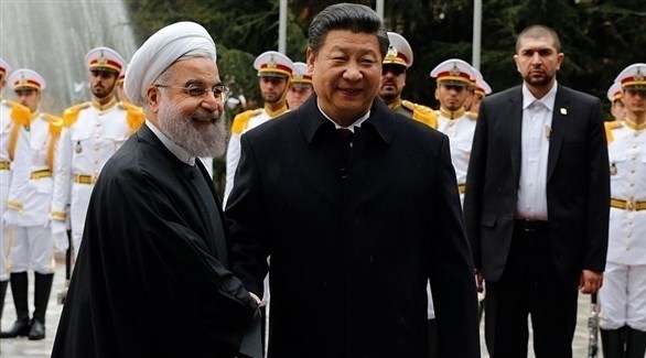 الرئيسان الصيني شي جين بينغ والإيراني حسن روحاني (أرشيف)