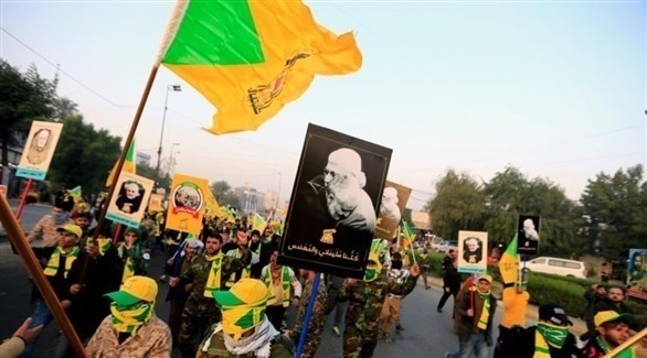 عناعناصر من كتائب حزب الله العراقي في تجمع لتشييع جثمان الجنرال قاسم سليماني في بغداد أوائل الشهر الماضي (رويترز)