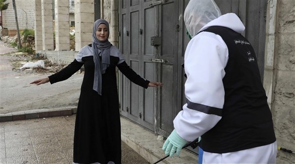امرأة يتم تعقيمها في فلسطين (أ ف ب)