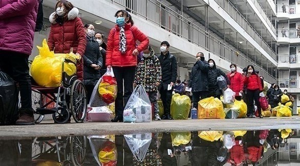 صينيون يغادرون مركزاً للحجر الصحي في ووهان (أرشيف)