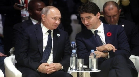 رئيس الوزراء الكندي جاستن ترودو  والرئيس الروسي فلاديمير بوتين (أرشيف)