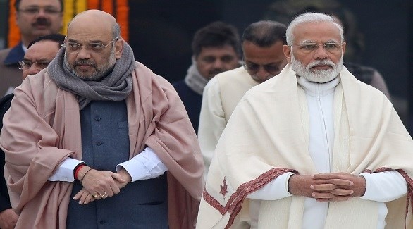 وزير الداخلية الهندي أميت شاه إلى جانب رئيس الوزراء ناريندرا مودي (أرشيف)