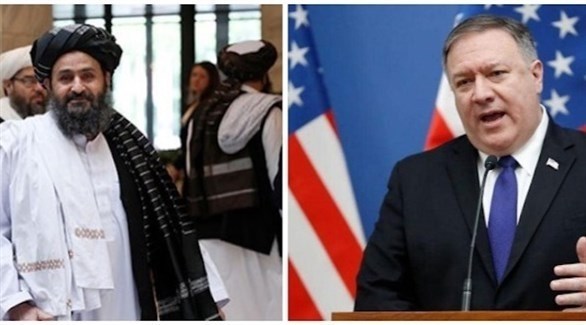 وزير الخارجية الأمريكي مايك بومبيو وكبير مفاوضي طالبان الملا بردار أخوند (أرشيف)