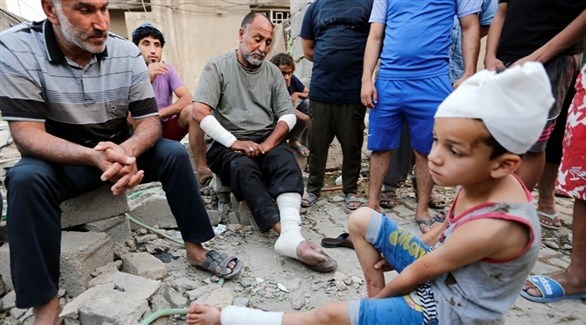 مصابون عراقيون بعد انفجار سابق (أرشيف)