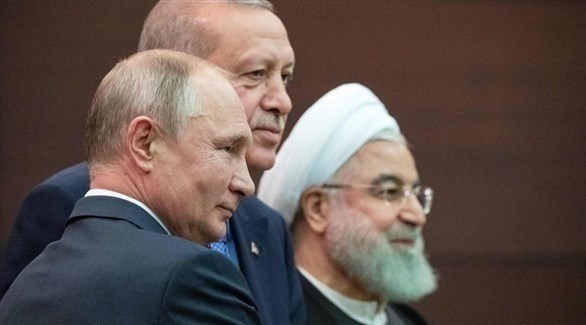 الرؤساء الروسي فلاديمير بوتين والتركي رجب طيب أردوغان والإيراني حسن روحاني.(أرشيف)