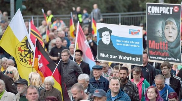 متظاهرون من حزب البديل من أجل ألمانيا ضد المستشارة أنجيلا ميركل والهجرة (أرشيف)