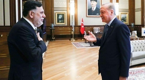 الرئيس التركي رجب طيب أردوغان ورئيس حكومة الوفاق السابقة فائز السراج (أرشيف)