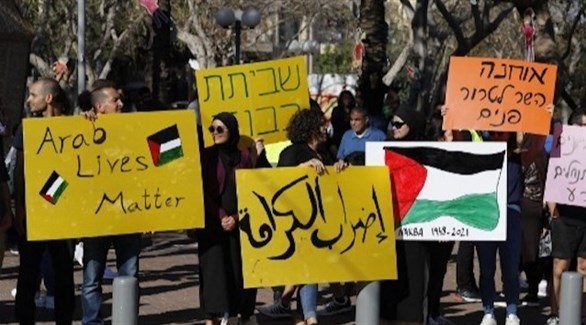 فلسطينيون يتظاهرون في يافا ضد العدوان على غزة (أ ف ب)