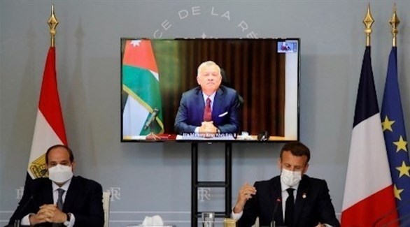 اجتماع ثلاثي بين الرئيس الفرنسي ماكرون ونظيره المصري السيسي والعاهل الأردني (أ ف ب)