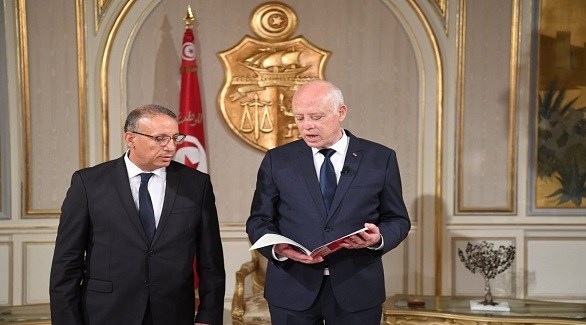 الرئيس التونسي قيس سعيّد والمكلف بتسيير وزارة الداخلية رضا غرسلاوي (أرشيف)