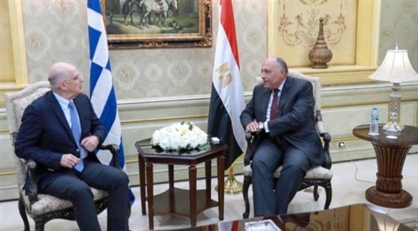 وزيرا الخارجية المصري سامح شكري واليوناني نيكوس ديندياس (أرشيف)