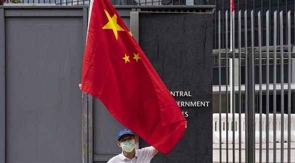شخص يرفع العلم الصيني (أرشيف / سوبا)