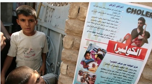 ملصق تحذيري من وباء الكوليرا على جدار في العراق (أرشيف)